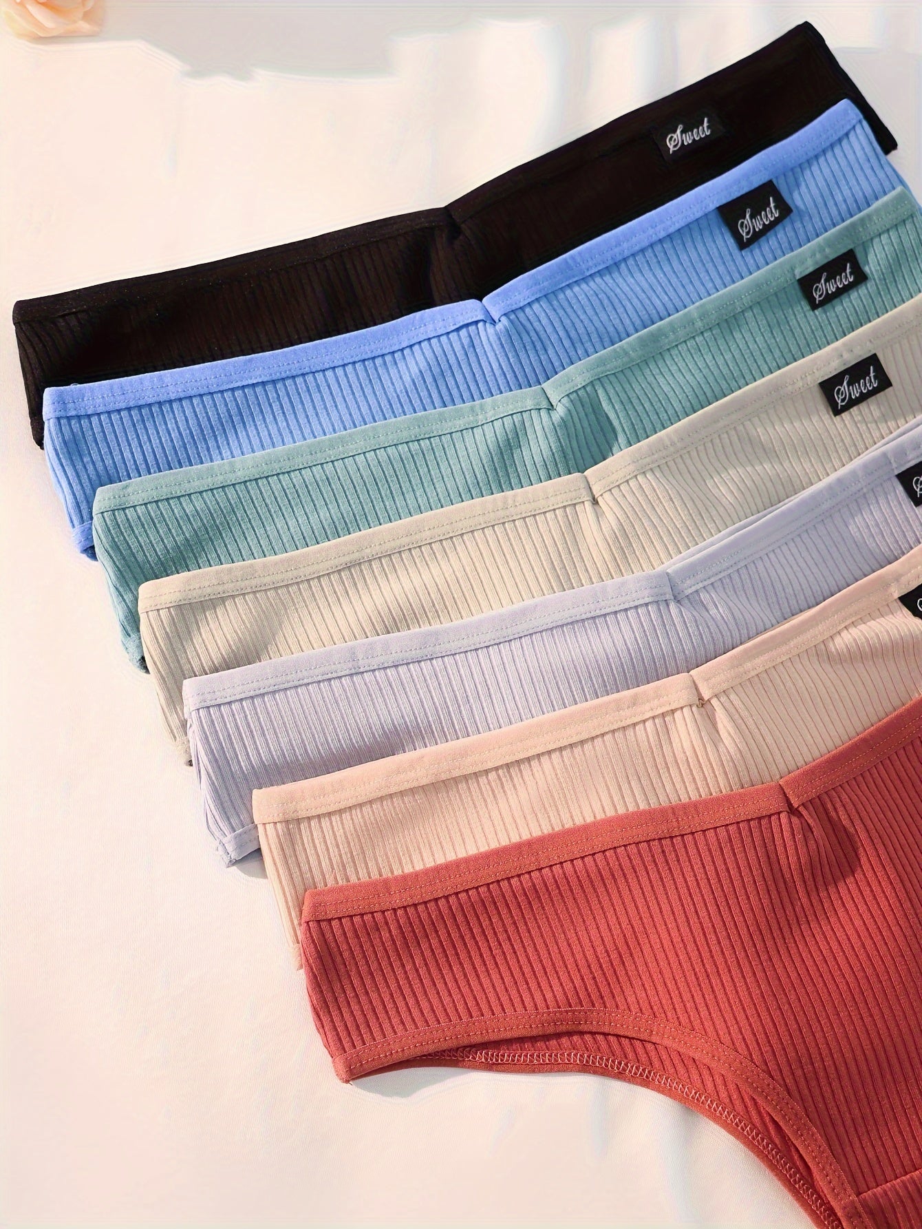 Assorted women's high-waisted hipster underwear in various colors from LuckeLadybug LLC