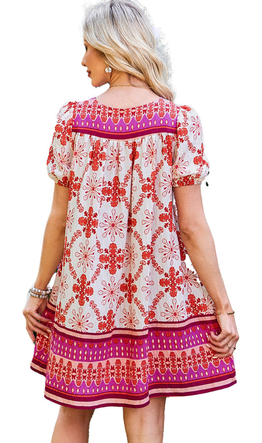 LuckeLadybug A Line boho floral mini dress back view red and pink floral print with puff sleeves in garden