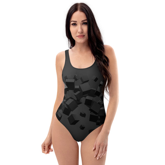 LuckeLadybug black pattern one-piece swimsuit with 3D cube geometric print worn by model