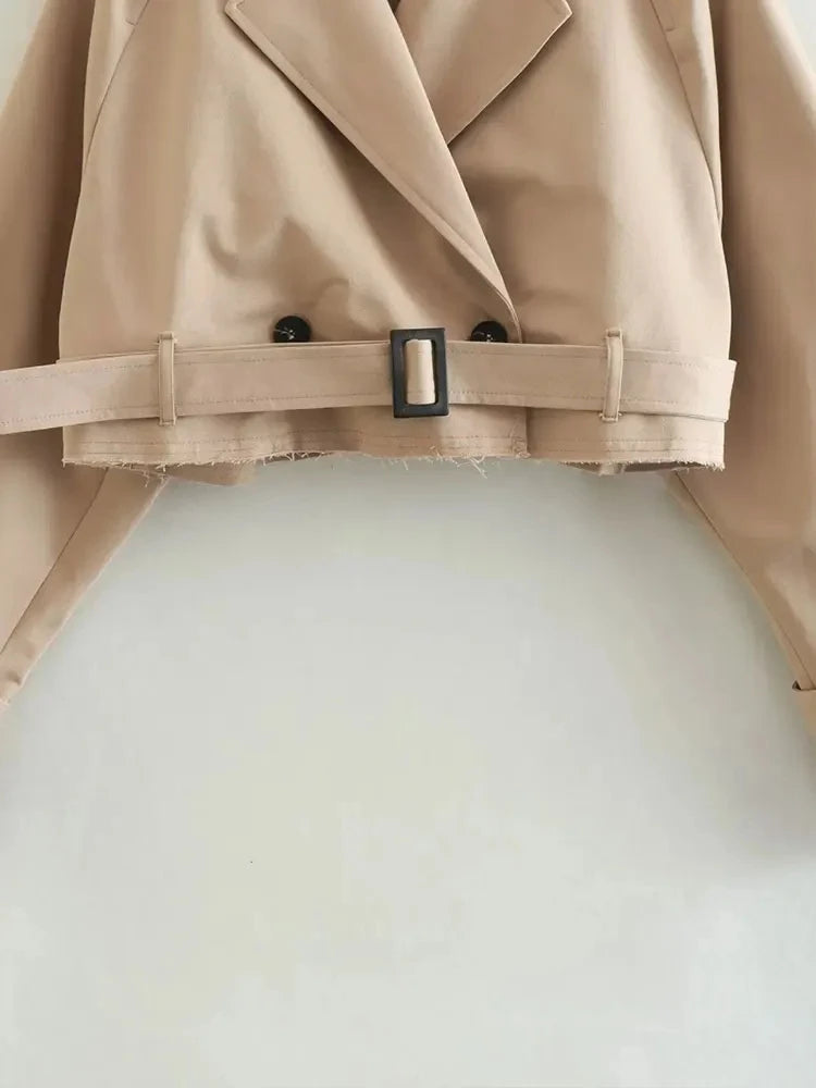 Belted cropped trench jacket women in beige with stylish double-breasted design and adjustable waist belt