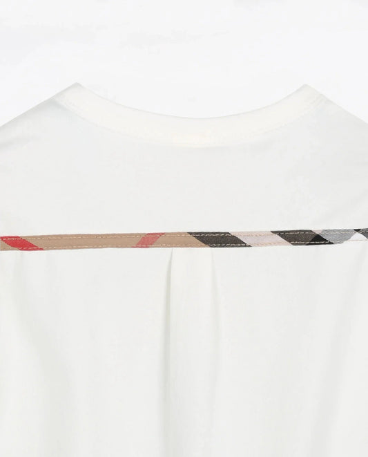 Back view of a baby plaid romper with decorative stitching in neutral colors for stylish baby clothes