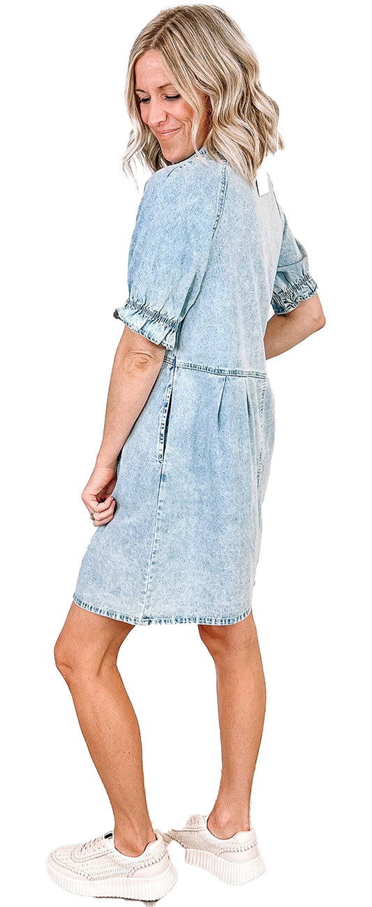 Back view of a blue denim ruffle sleeve dress by LuckeLadybug, styled with casual white sneakers