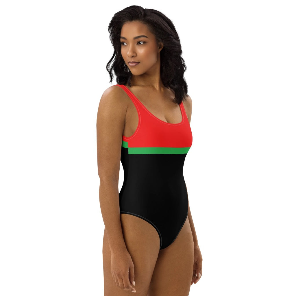 LuckeLadybug bold color one-piece swimsuit with red top and black bottom on model