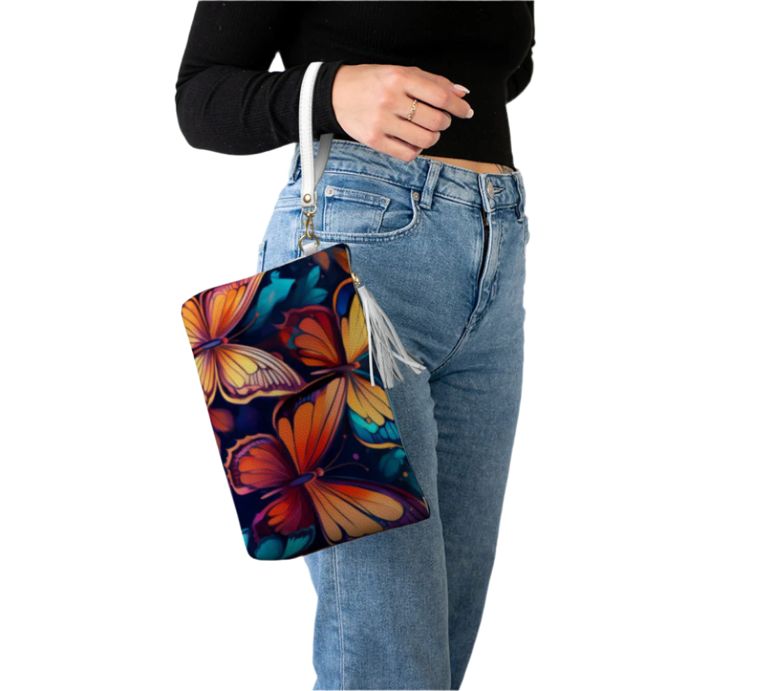 Vegan leather butterfly design cosmetic bag with colorful butterflies held by woman wearing black top and jeans