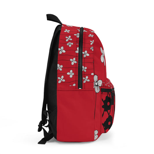 Side view of a red custom design backpack featuring floral patterns and durable material