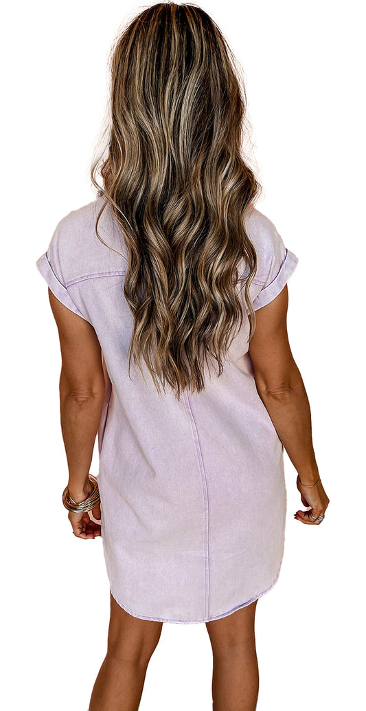 Back view of a lavender denim shirt dress for women with rolled sleeves and a relaxed fit