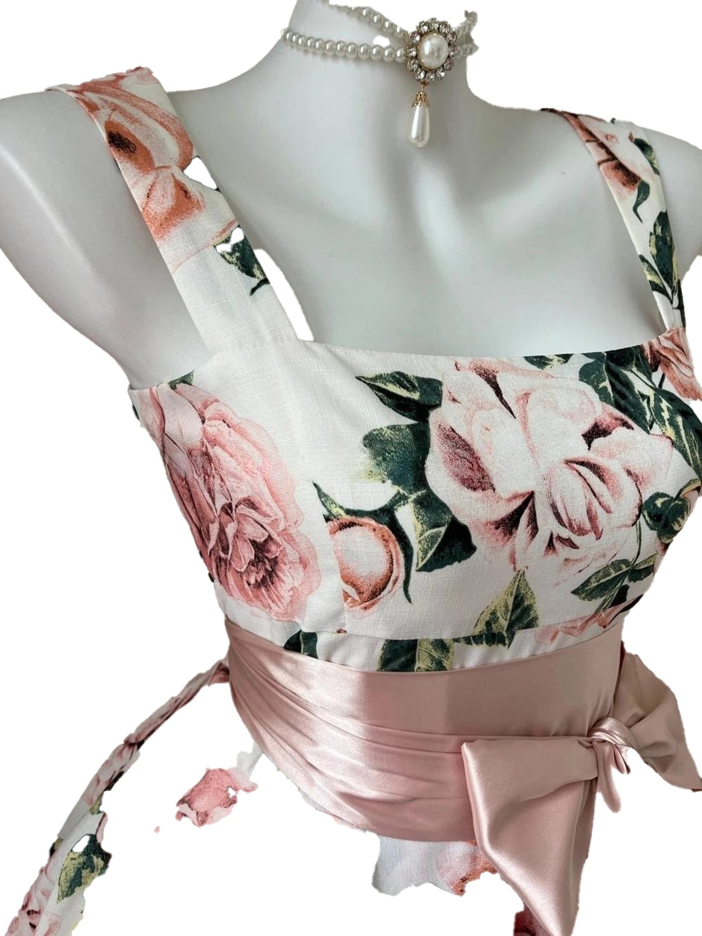 Floral sleeveless mini dress for women featuring a floral pattern and a satin bow detail
