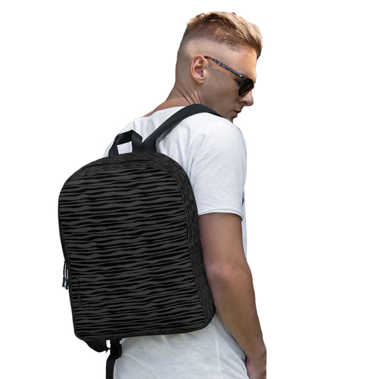 LuckeLadybug black striped backpack worn by man in white tee and sunglasses featuring padded straps and sleek urban design