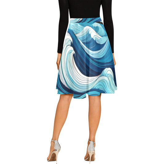 Woman wearing ocean waves midi skirt by LuckeLadybug with blue and white wave patterns paired with black top