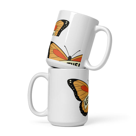 White glossy mug with butterfly design by LuckeLadybug shown in two stacked positions