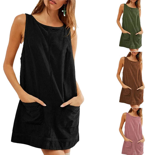 Women's corduroy pinafore dress available in black, green, brown, and pink with pocket details