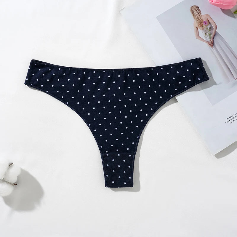 LuckeLadybug women's cotton thong panties in navy blue with white polka dots on a flat surface