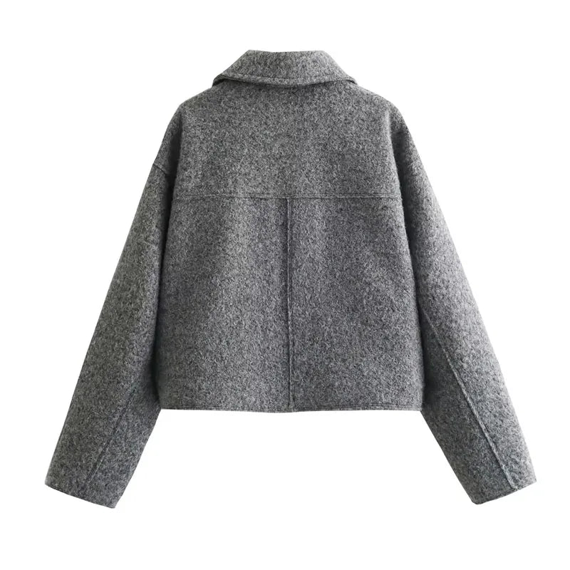 Back view of a women's tweed cropped jacket in gray with a relaxed fit and stylish design