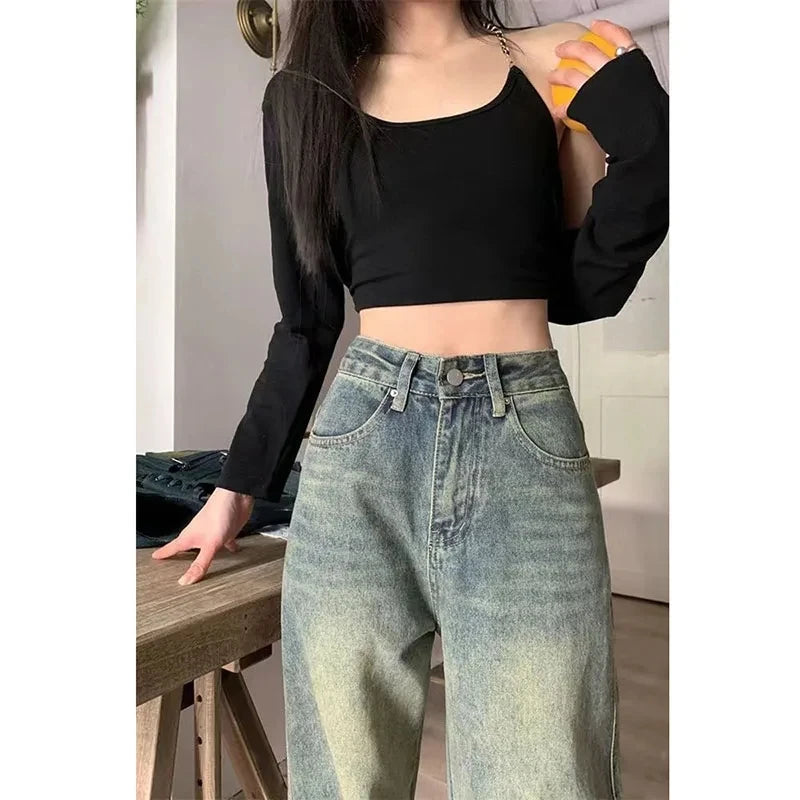 Trendy model wearing y2k baggy jeans women paired with a stylish black crop top