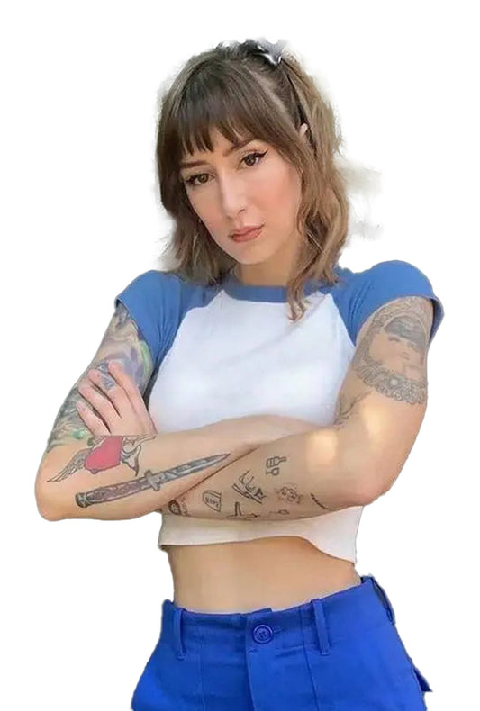 Stylish model wearing a 90s vintage crop top with blue sleeves and a fitted white body