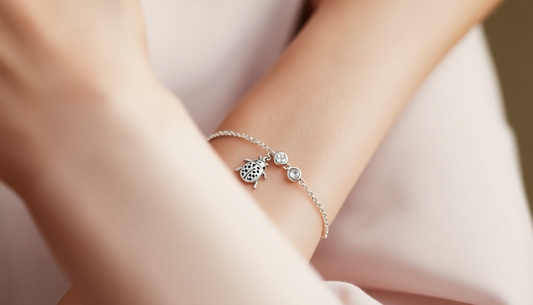 Delicate sterling silver bracelets for women with charm and crystal accents on wrist