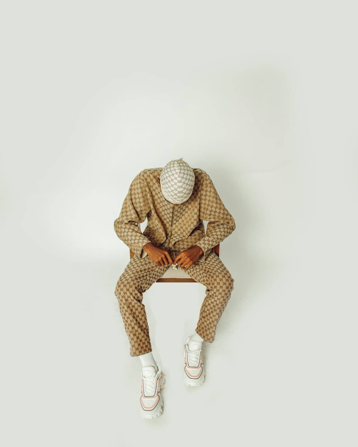 A man in a suit sitting on a bench