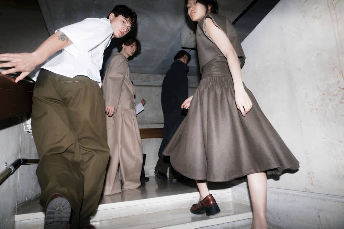 People are descending a staircase together.