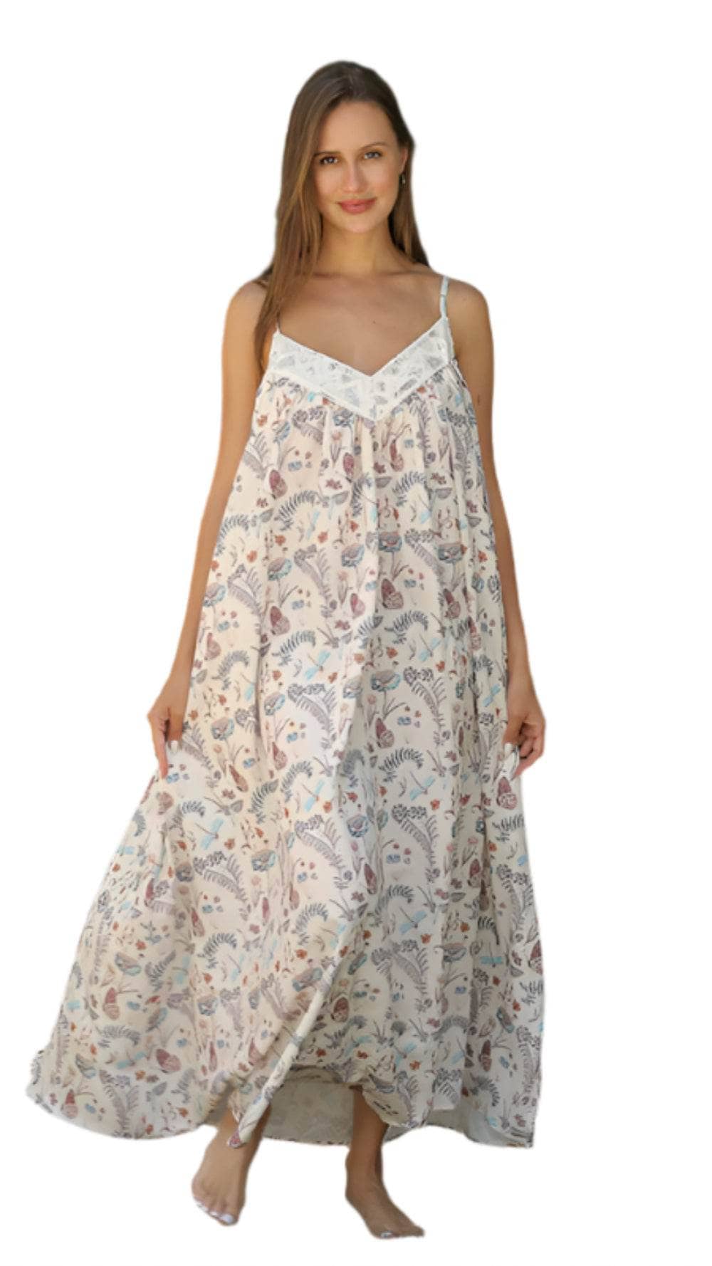 Woman wearing a flowy floral patterned fashionable maxi dresses with adjustable straps and lightweight fabric
