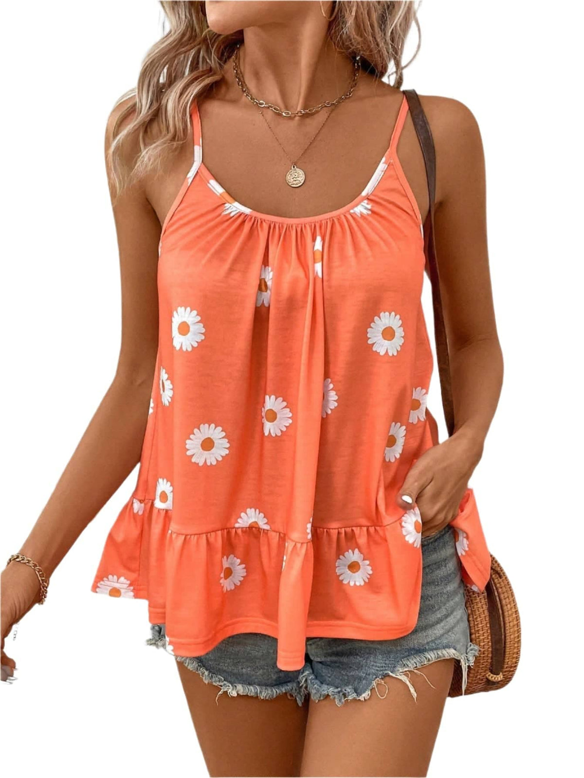 Womens cami tops in bright orange with white floral pattern and ruffled hem paired with denim shorts