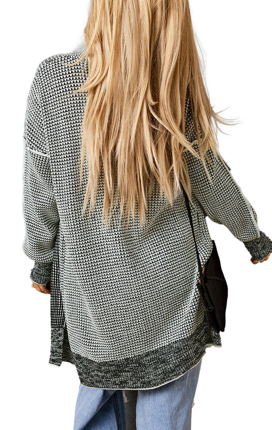 Back view of a gray plaid open front cardigan styled with relaxed jeans and long hair