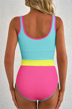 Colorful one piece swimsuit bathing suits with a blue, pink, and yellow design for stylish beachwear