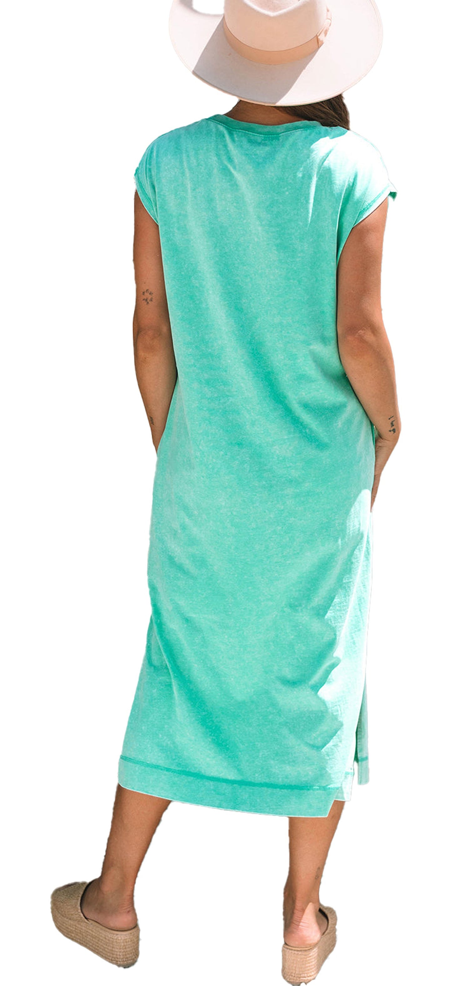 Back view of model in mint H line carrot mineral wash t-shirt dress with straw hat and espadrille wedges