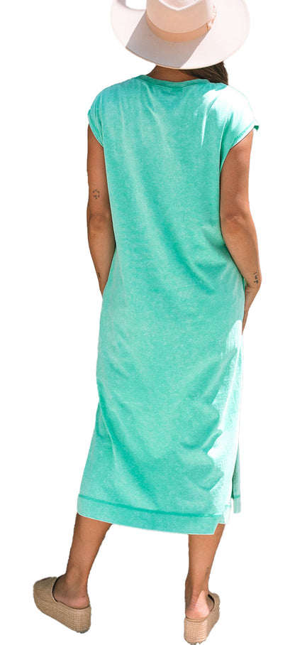 Back view of model in mint H line carrot mineral wash t-shirt dress with straw hat and espadrille wedges