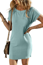 LuckeLadybug model wearing blue striped t-shirt dress ribbed short sleeve mini with chest pocket and crossbody bag