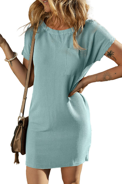 LuckeLadybug model wearing blue striped t-shirt dress ribbed short sleeve mini with chest pocket and crossbody bag