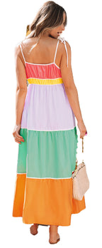 Back view of model wearing multicolor colorblock maxi dress with tie straps tiered panels
