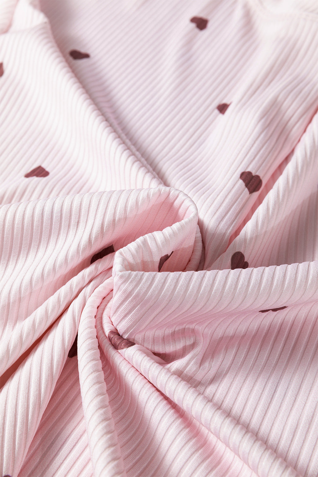 Soft pink lounge room set fabric with heart patterns and ribbed texture for comfy wear