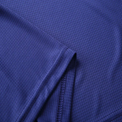 Close-up of a purple men's quick dry polo shirt fabric, showcasing its soft texture and breathable design