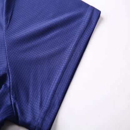 Close-up of men's quick dry polo shirt sleeve in blue featuring breathable fabric for comfort