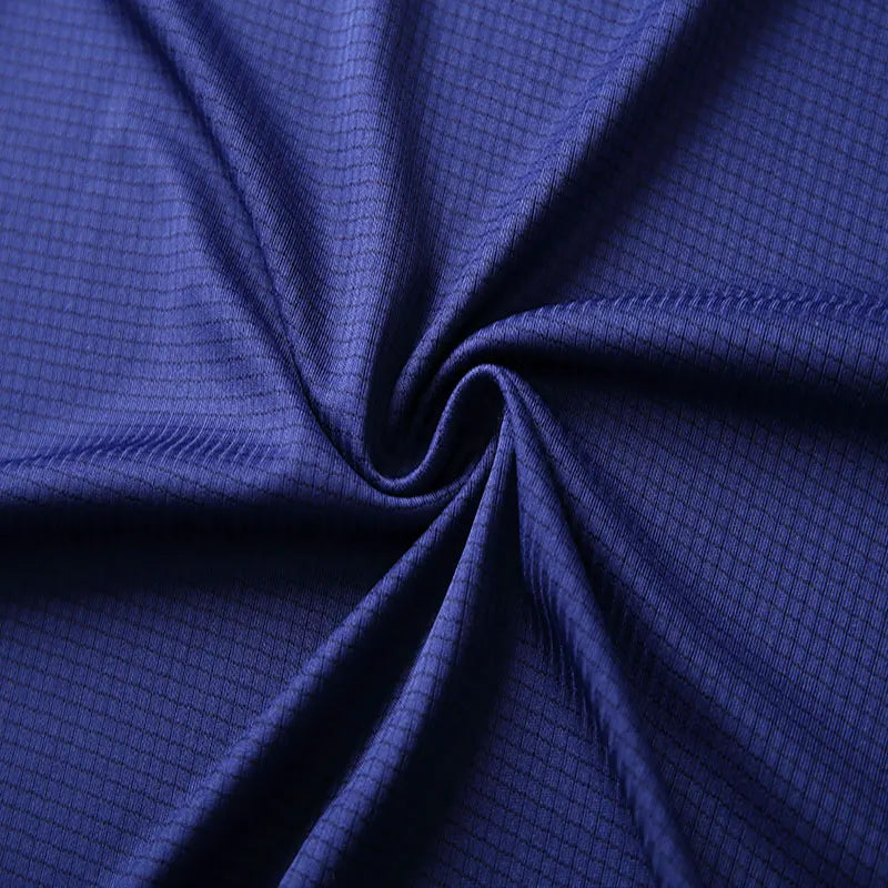 Close-up of fabric texture for men's quick dry polo shirt in navy color