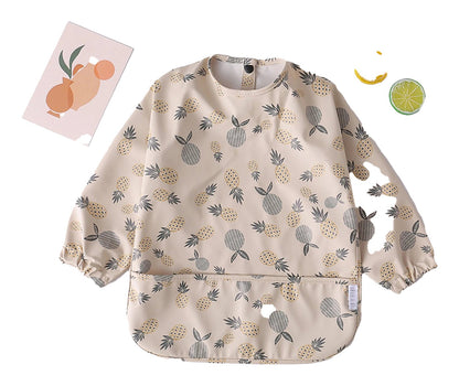 LuckeLadybug LLC Waterproof baby art smock featuring a fun fruit print with long sleeves and a front pocket