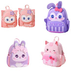 Four cute cartoon animal backpacks arranged in a 2x2 grid: two pink bunny backpacks on the top left, a purple rabbit backpack with a pink bow on the top right, and a purple cat backpack with flowers on the bottom left, plus a pink cat backpack with strawberry details on the bottom right.