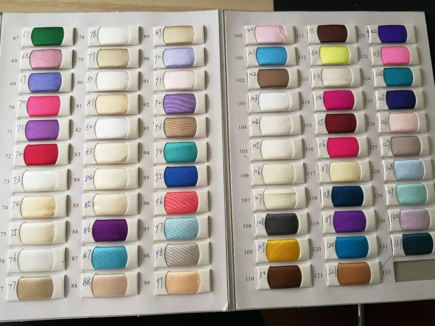 Color swatches for glossy patent leather mini dress showcasing a variety of vibrant shades and textures