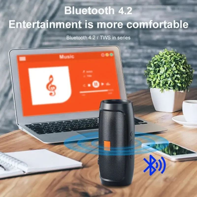 LuckeLadybug portable wireless speaker with bluetooth, displaying controls and Bluetooth connection icon near a laptop