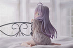 LuckeLadybug LLC anime figure featuring a character with purple hair in a knitted sweater on a bed