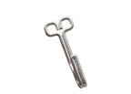 A silver metal key-shaped tool resting on an open hand against a plain white background.