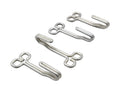 Four small silver metal hook-like hardware pieces arranged diagonally on a plain white background.