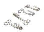 Four small silver metal hook-like hardware pieces arranged diagonally on a plain white background.