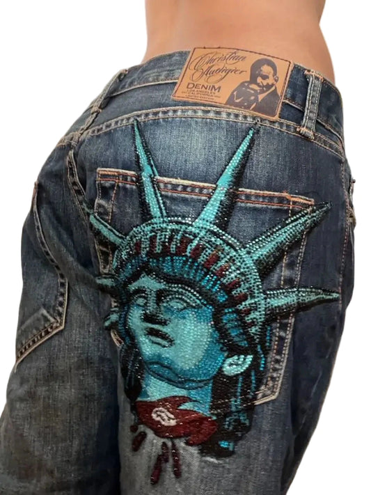 Y2K baggy jeans for women featuring intricate Liberty Statue embroidery and a classic denim finish