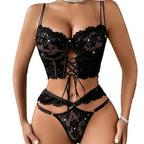 Black lace lingerie set on a white background