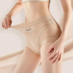 Beige shapewear with 'UNIQUE' branding on a neutral background