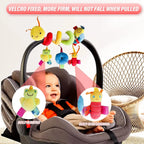 Baby in car seat with colorful toy hanging above, featuring text about velcro and firmness.
