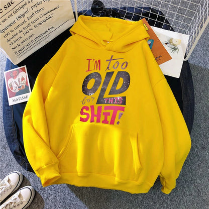 Women's humorous graphic hoodies in yellow with fun text that reads I'm too old for this shit