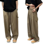 Person wearing beige wide-leg pants with a black top in two different poses.