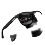 Black sunglasses with reflective car image on a black background